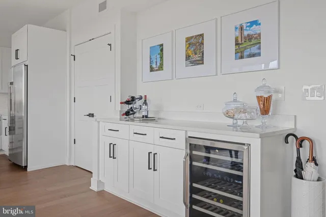 a bedroom with a bed and a night stand