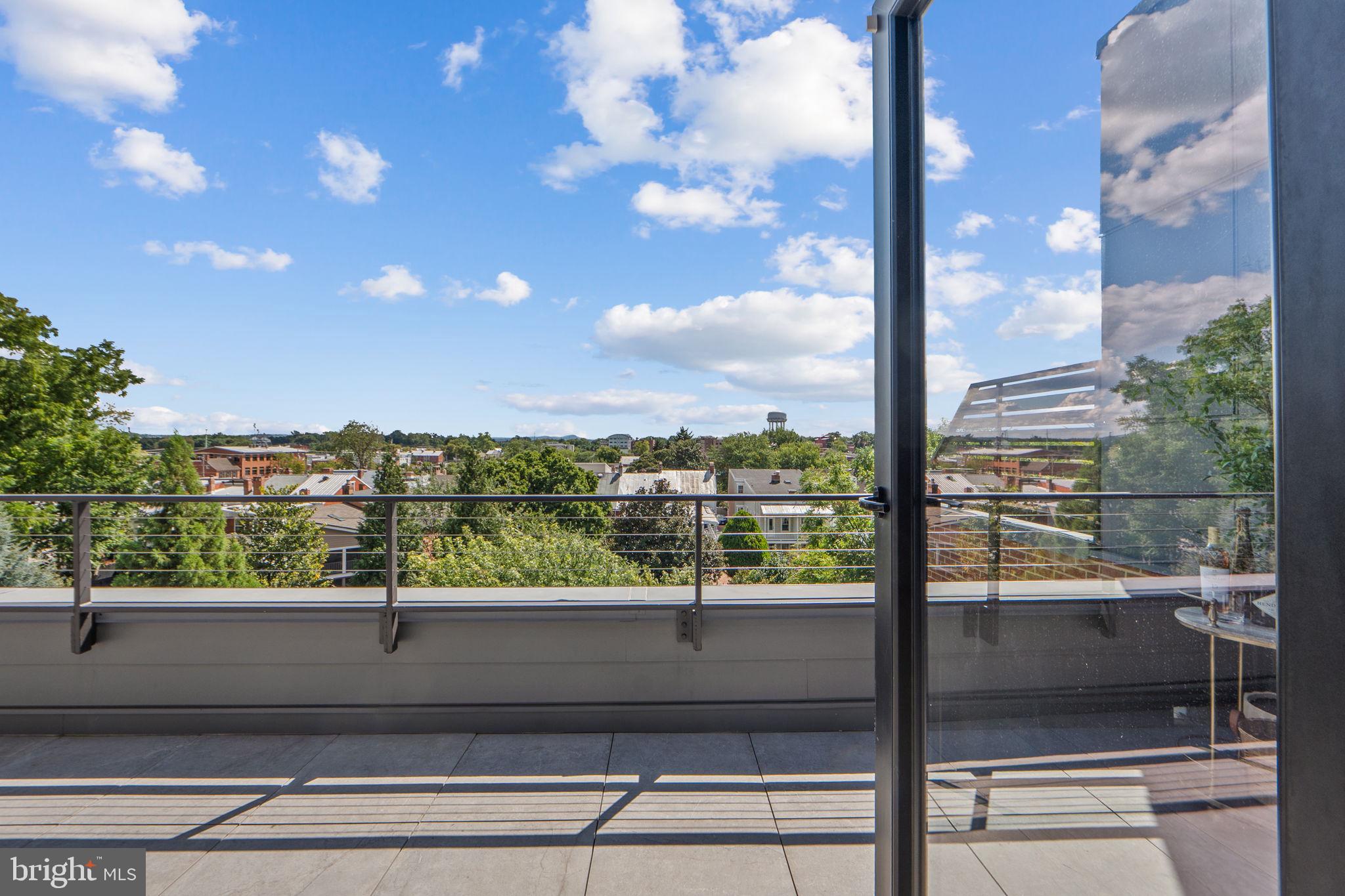 210 East 2nd Street, Unit 402 Frederick, MD 21701 - Photo 30 of 71 a view of a glass door with a balcony