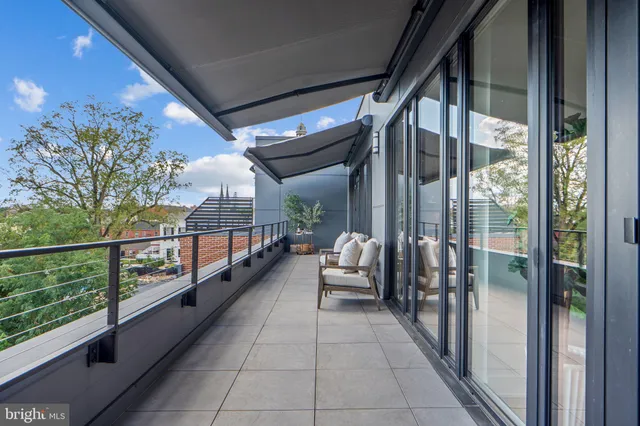 a bedroom with a bed and a potted plant