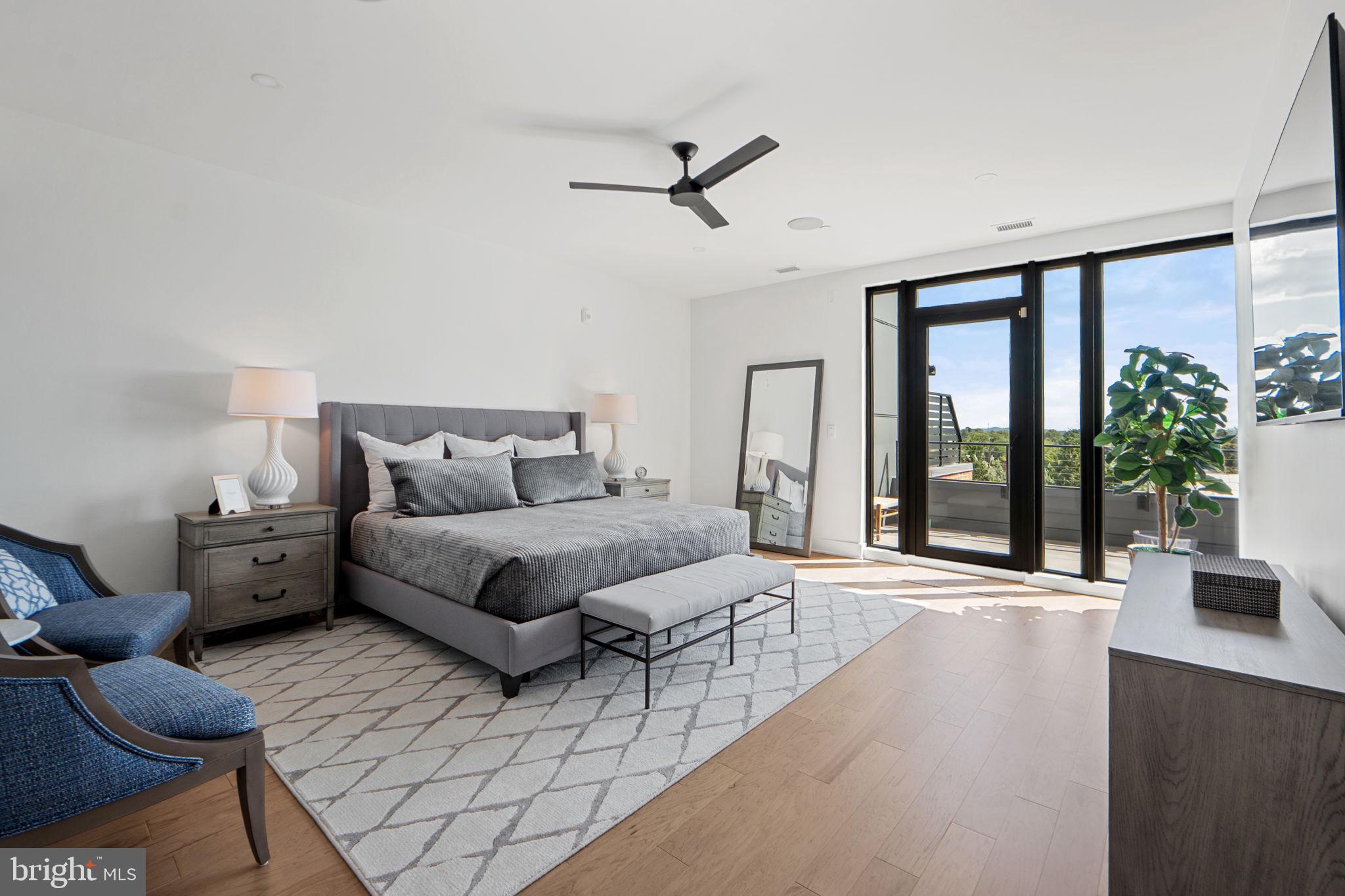210 East 2nd Street, Unit 402 Frederick, MD 21701 - Photo 42 of 71 a bedroom with furniture and a large window