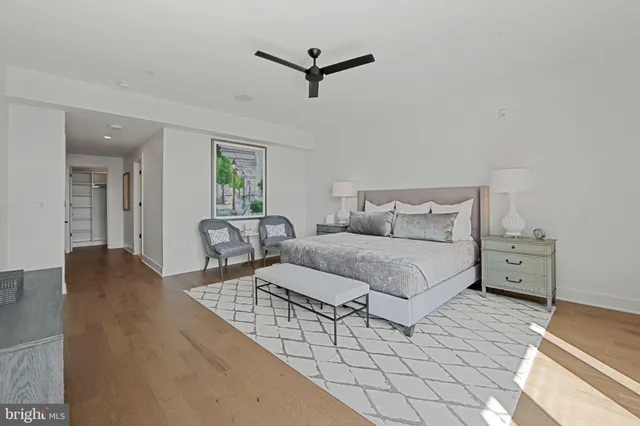 a view of residential houses with cars parked in front of house