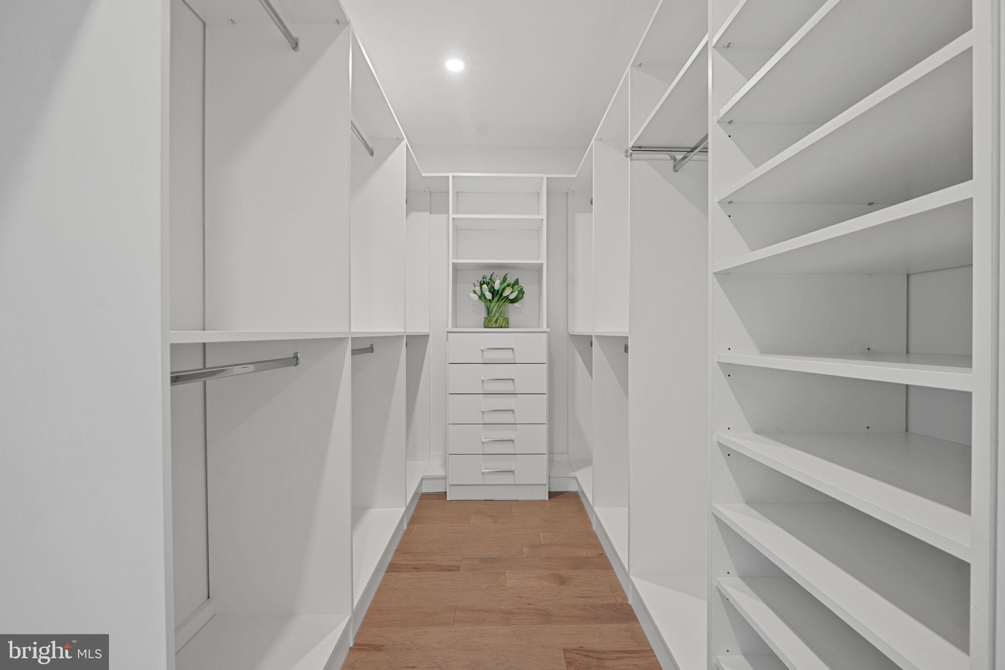 210 East 2nd Street, Unit 402 Frederick, MD 21701 - Photo 49 of 71 a view of walk in closet with empty racks