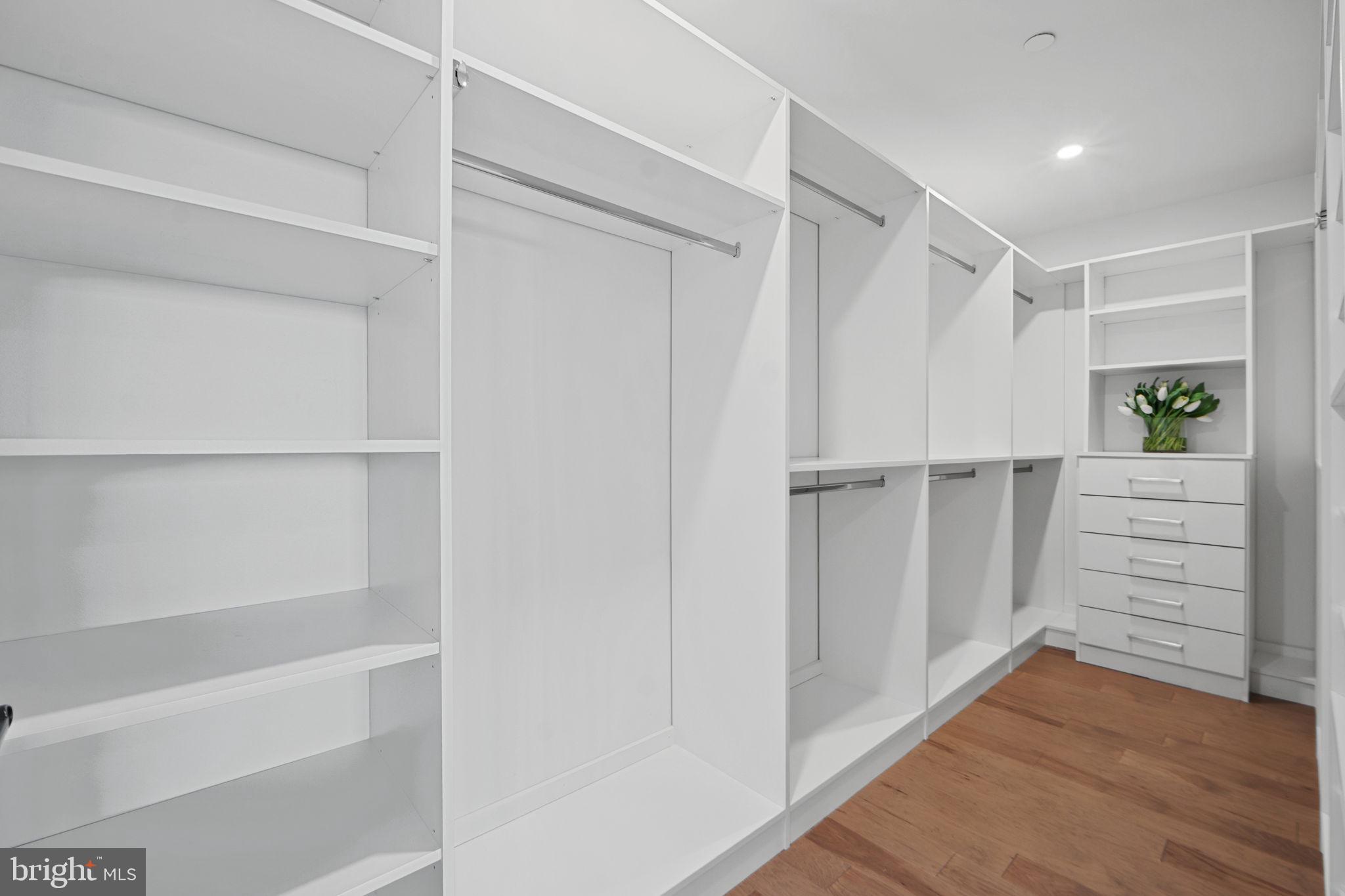 210 East 2nd Street, Unit 402 Frederick, MD 21701 - Photo 50 of 71 a view of walk in closet with empty racks
