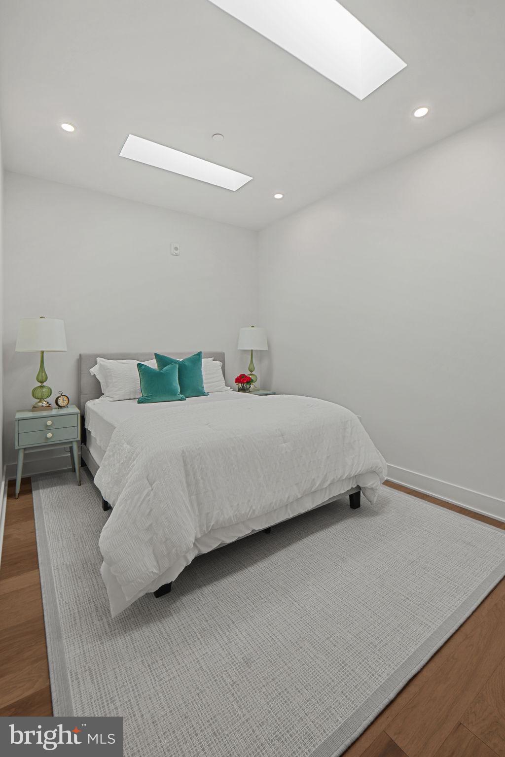 210 East 2nd Street, Unit 402 Frederick, MD 21701 - Photo 53 of 71 a bedroom with a bed and a couch