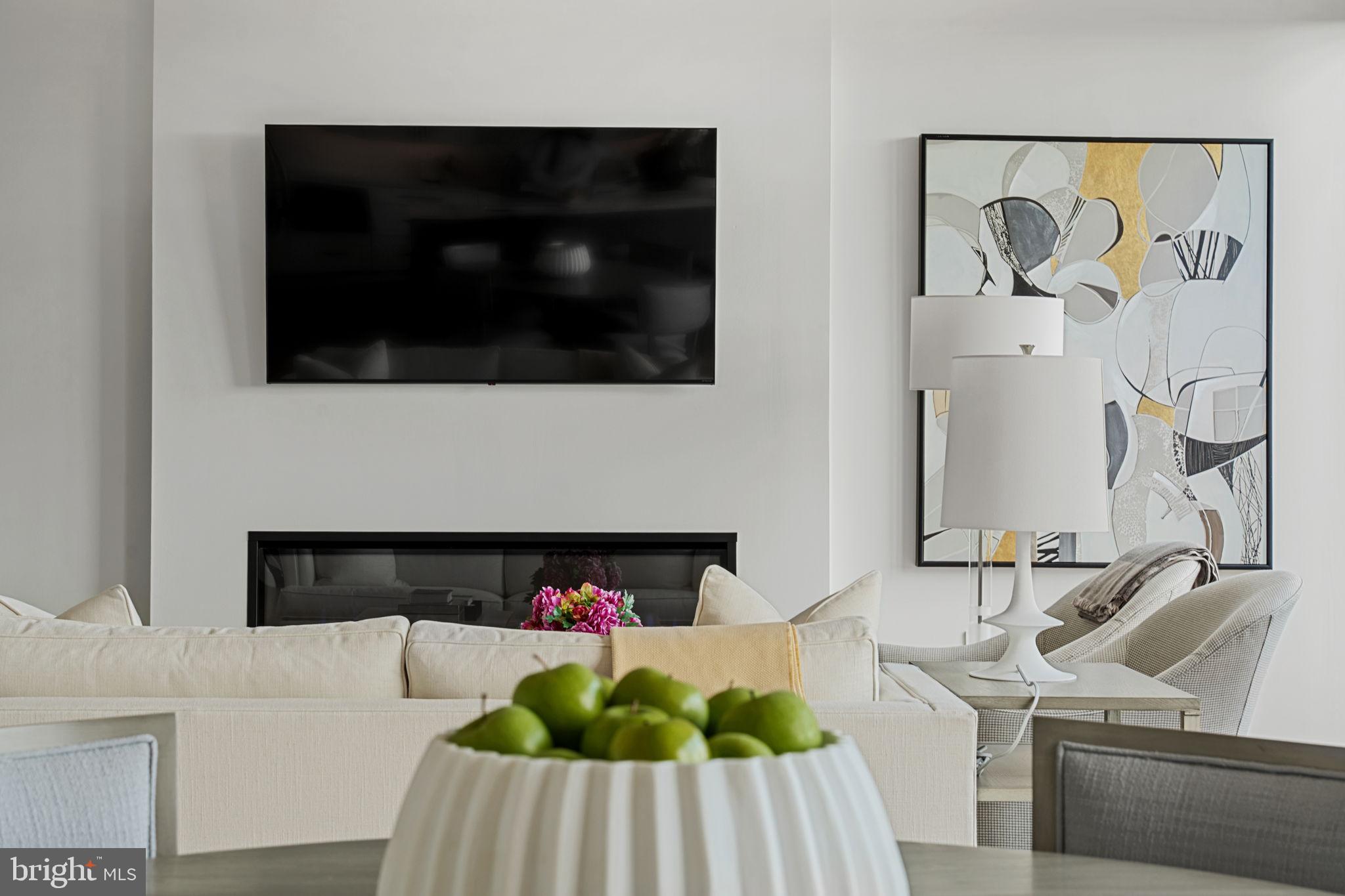 210 East 2nd Street, Unit 402 Frederick, MD 21701 - Photo 7 of 71 a living room with furniture and a fireplace