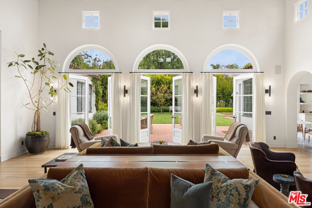 765 Ranch Lane Pacific Palisades, CA 90272 - Photo 4 of 23 a living room with furniture and a large window