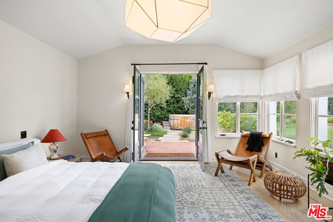 765 Ranch Lane Pacific Palisades, CA 90272 - Photo 10 of 23 a bedroom with furniture and a window