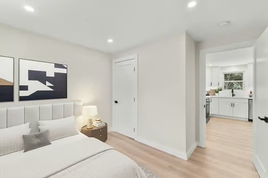 7 Edward Street Canton, MA 02021 - Photo 12 of 22 a bedroom with a large bed and a view of living room