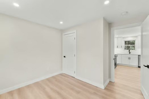 7 Edward Street Canton, MA 02021 - Photo 13 of 22 a view of a room with a stylish ceiling fan and entryway
