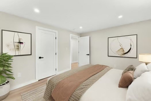 7 Edward Street Canton, MA 02021 - Photo 14 of 22 a bedroom with a bed and a painting on the wall