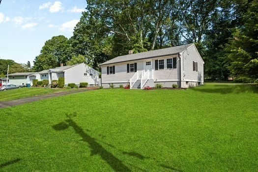 7 Edward Street Canton, MA 02021 - Photo 19 of 22 a front view of a house with a yard and trees