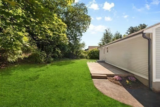 7 Edward Street Canton, MA 02021 - Photo 20 of 22 a backyard of a house with lots of green space