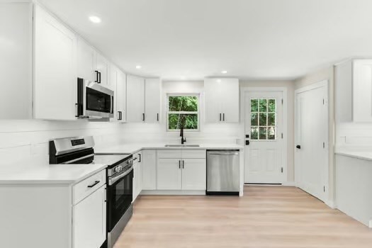 7 Edward Street Canton, MA 02021 - Photo 5 of 22 a kitchen with a sink stove top oven and refrigerator