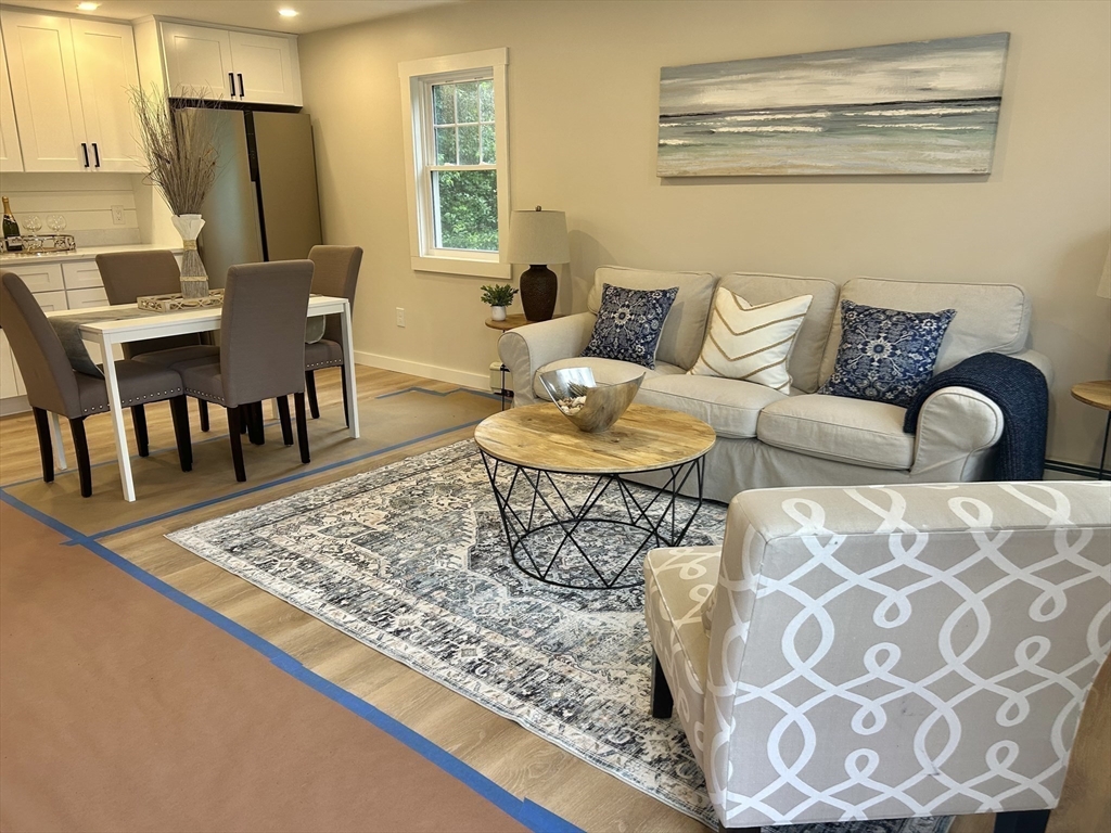 7 Edward Street Canton, MA 02021 - Photo 8 of 22 a living room with furniture and a wooden floor