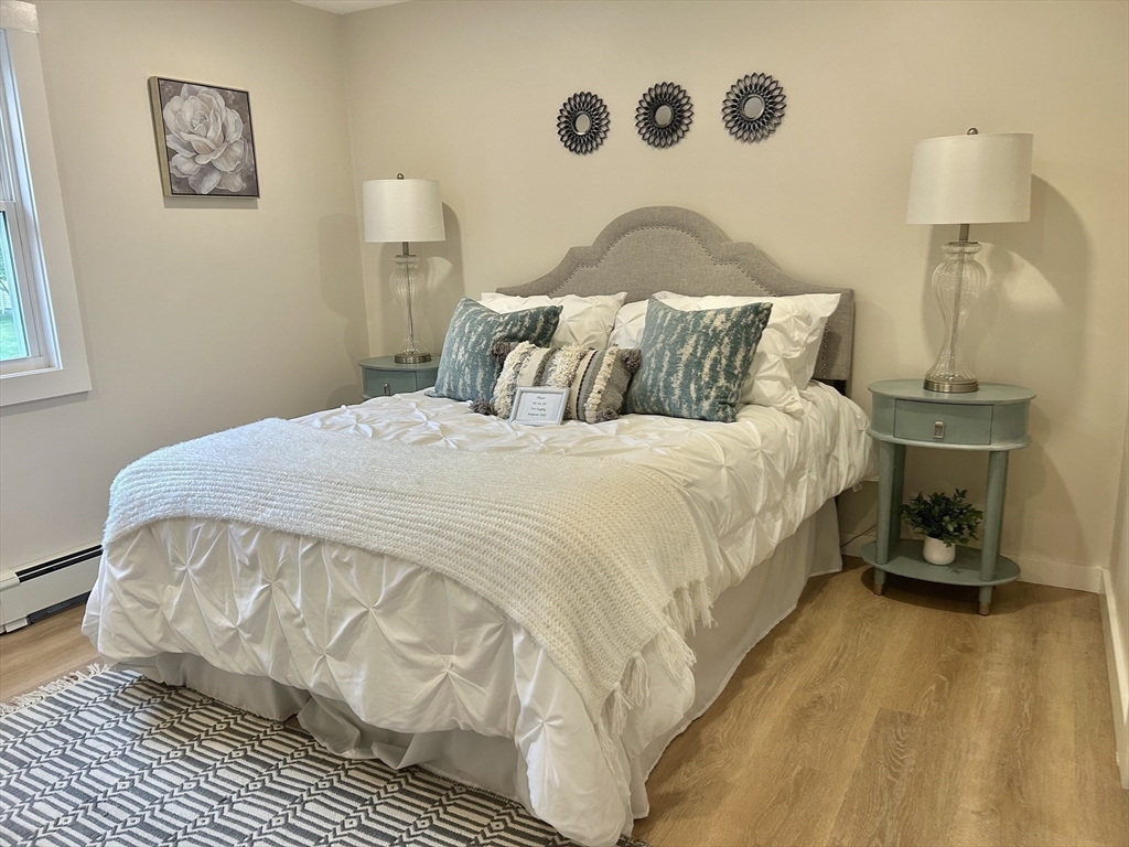 7 Edward Street Canton, MA 02021 - Photo 10 of 22 a bedroom with a bed and a table