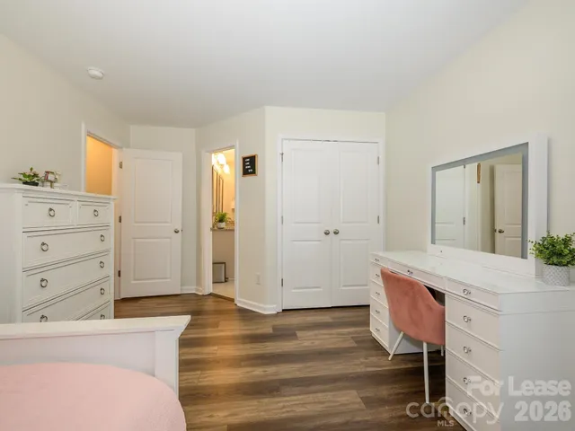 a room with a dresser and a chair