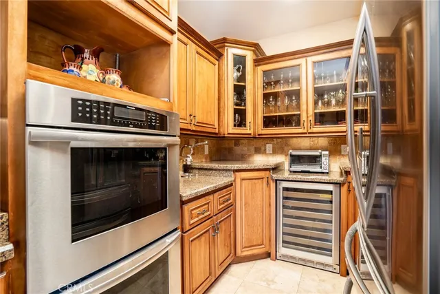 a kitchen with stainless steel appliances and cabinets