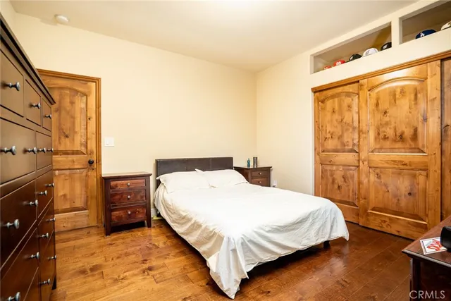 a bedroom with a bed and dresser