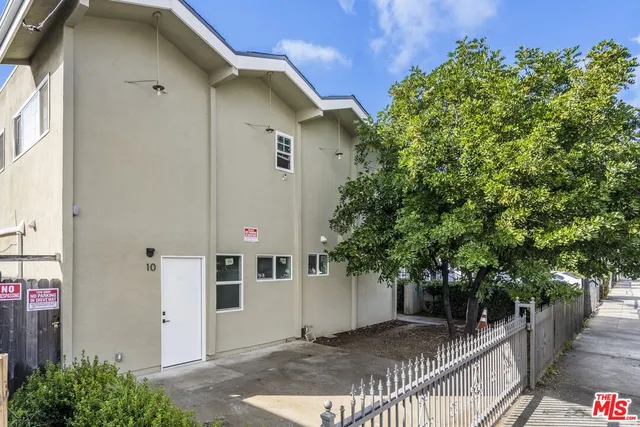 a view of a house with a tree