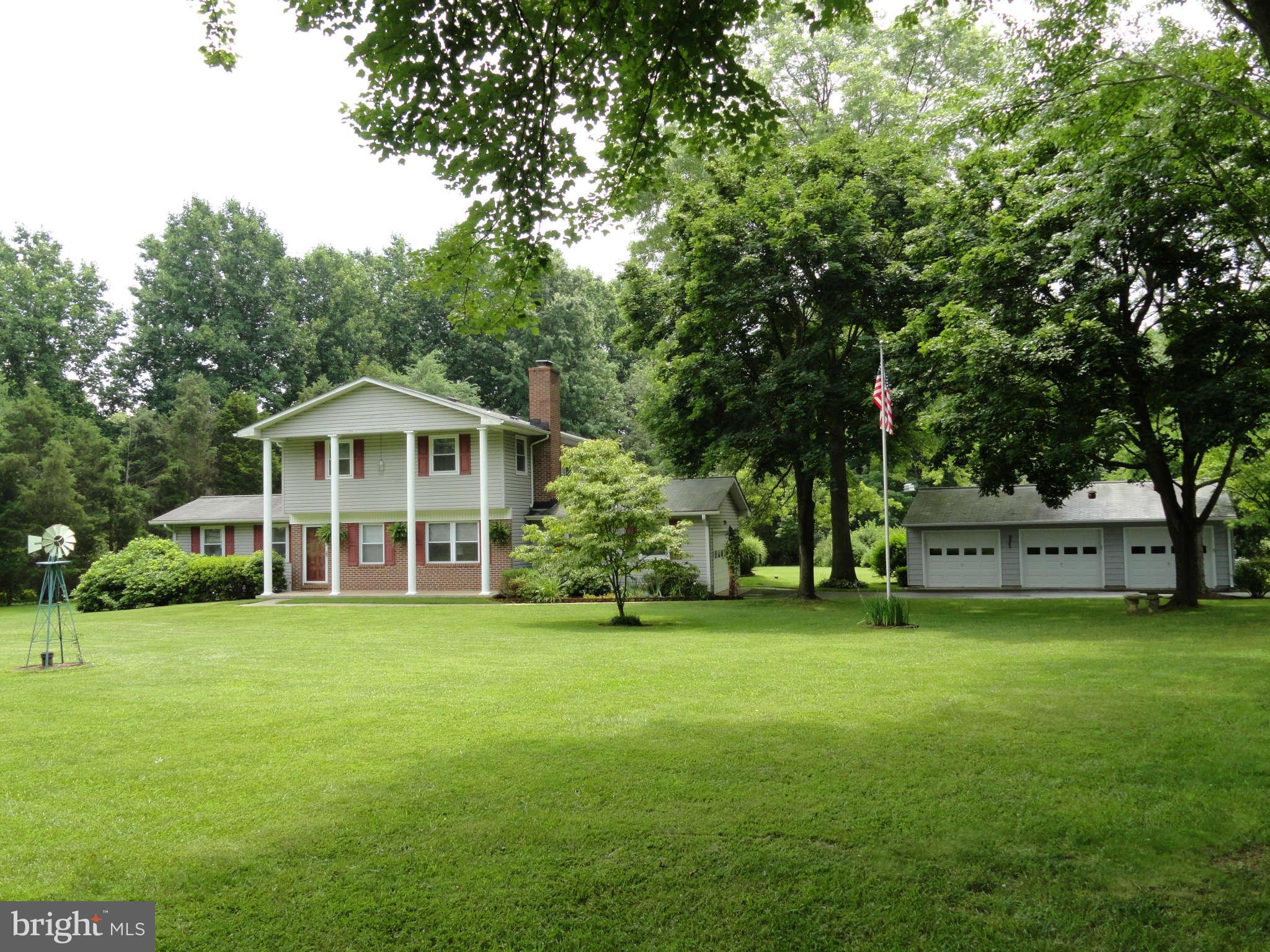a view of a house with a big yard