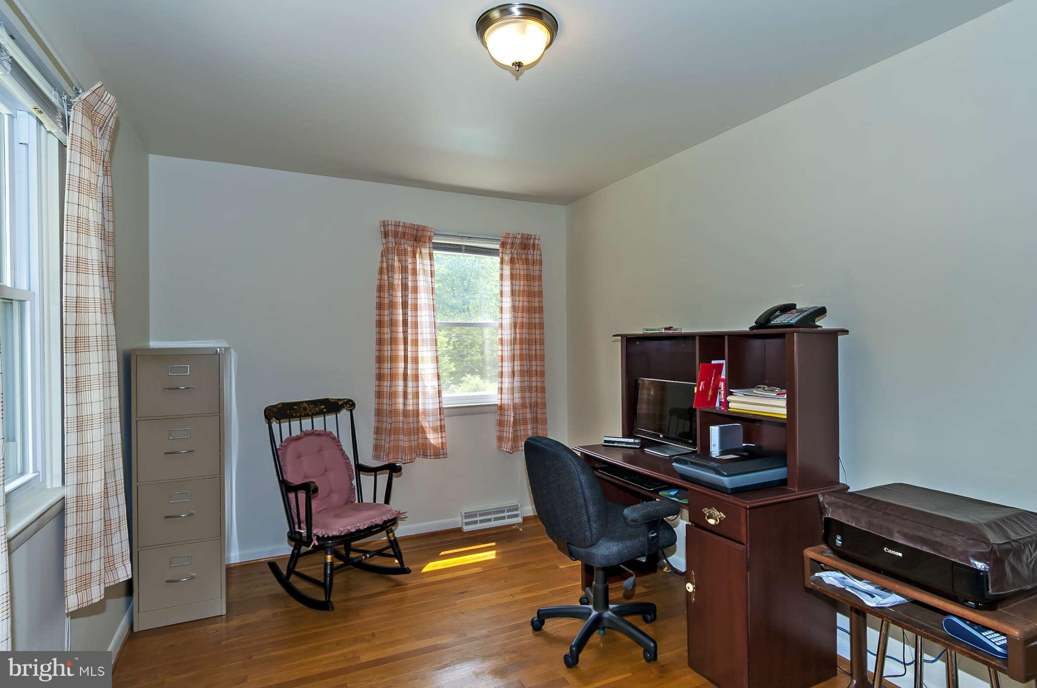 12955 Triadelphia Mill Road Clarksville, MD 21029 - Photo 16 of 29 a view of a workspace with furniture and a window