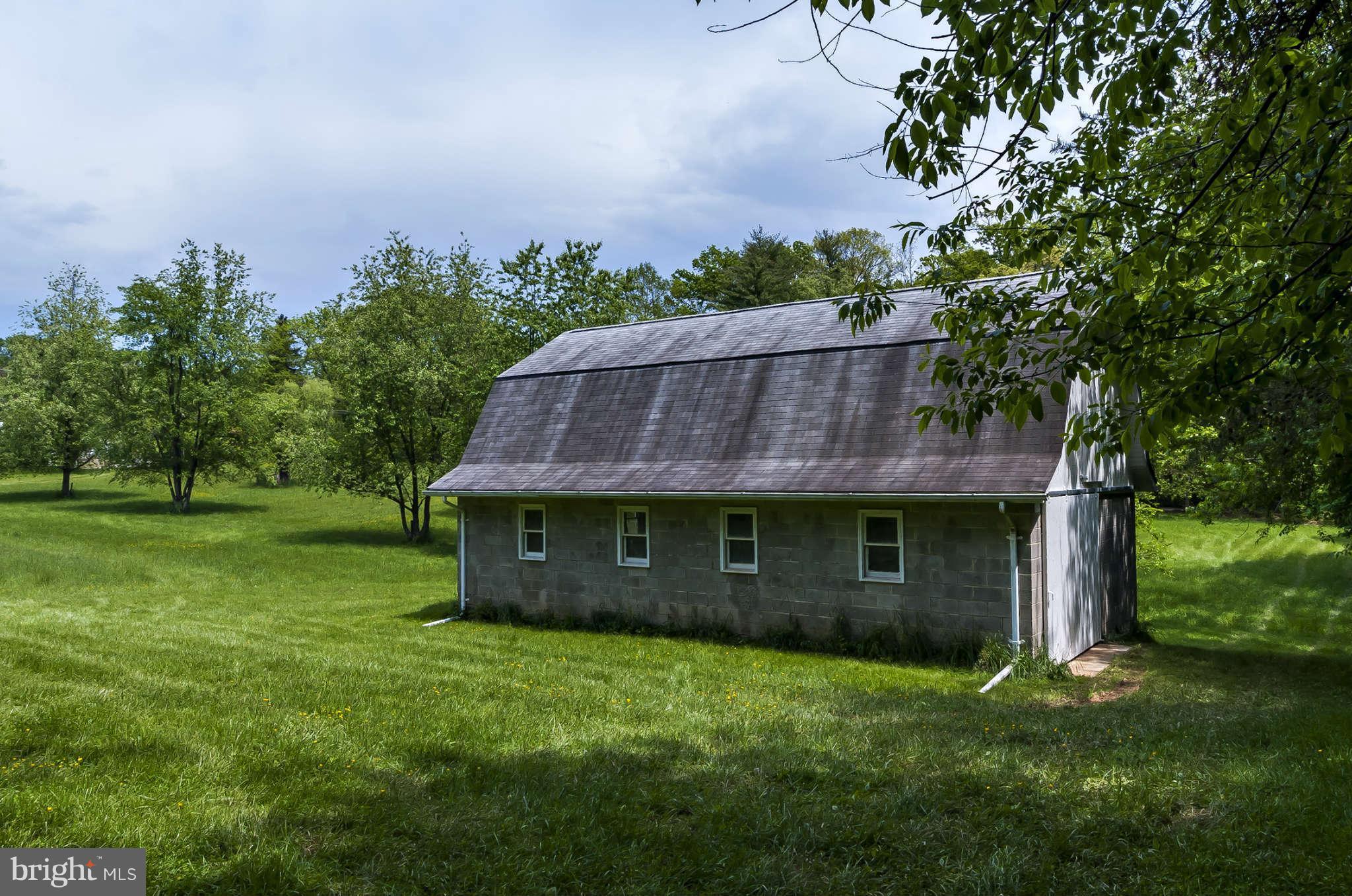 12955 Triadelphia Mill Road Clarksville, MD 21029 - Photo 24 of 29 a view of a barn in the middle of a yard