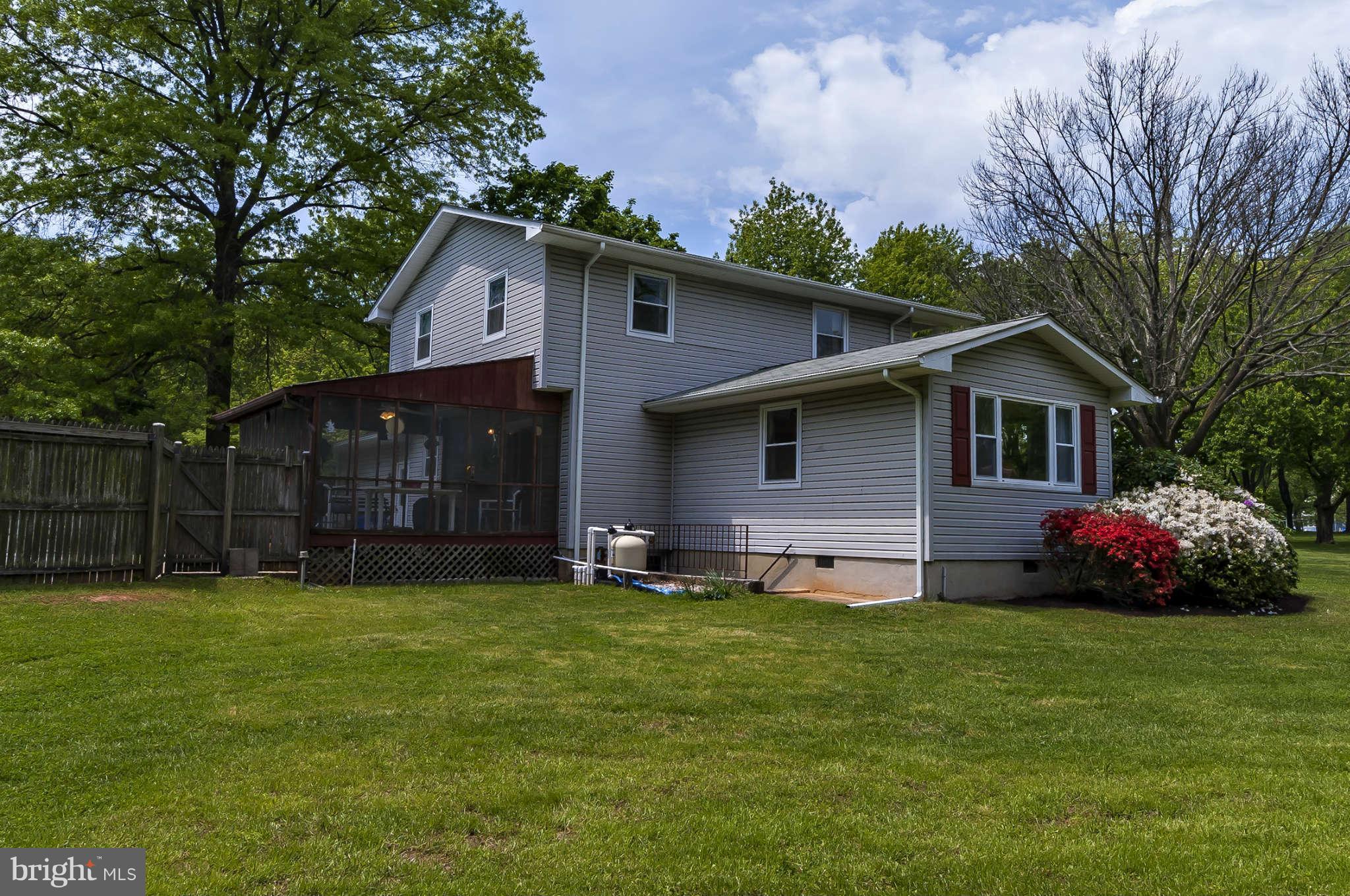 12955 Triadelphia Mill Road Clarksville, MD 21029 - Photo 25 of 29 a front view of house with yard and green space