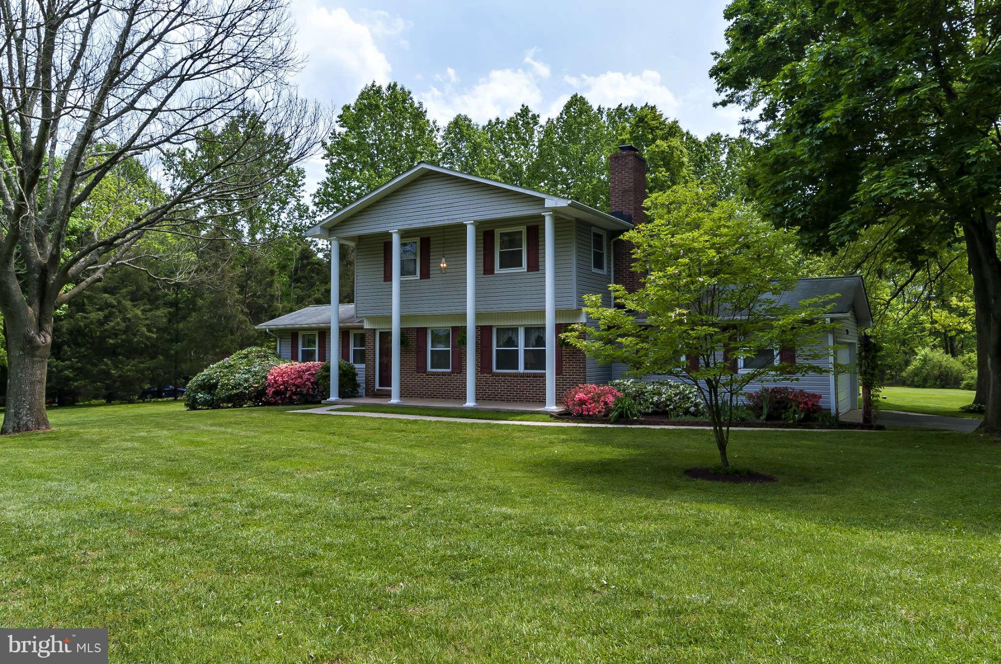 12955 Triadelphia Mill Road Clarksville, MD 21029 - Photo 27 of 29 a view of a house with a yard