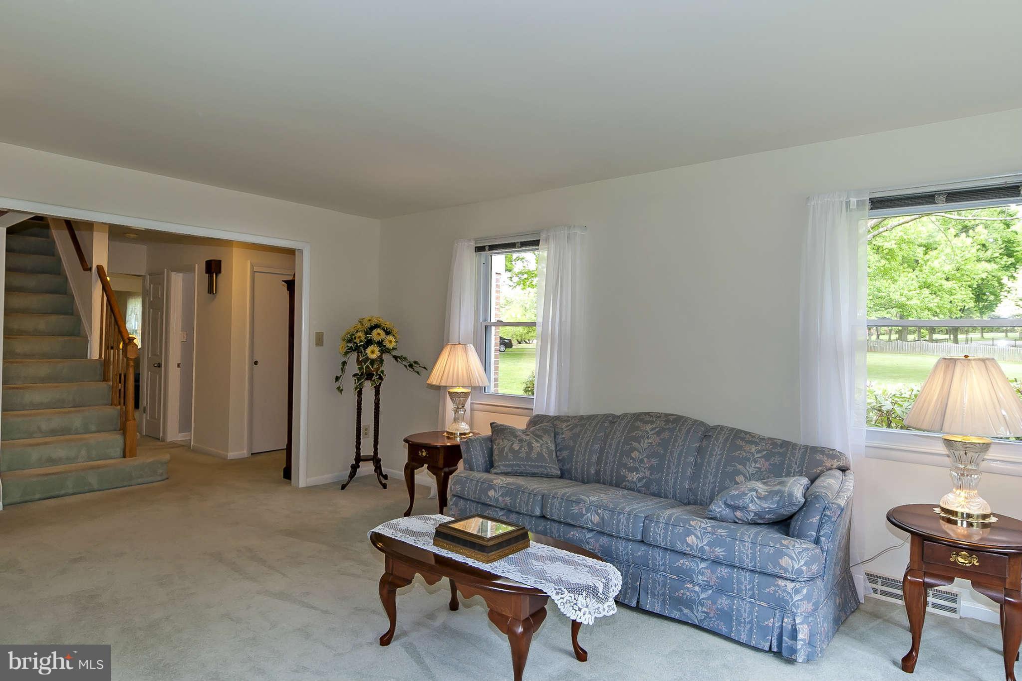 12955 Triadelphia Mill Road Clarksville, MD 21029 - Photo 7 of 29 a living room with furniture a window and a table