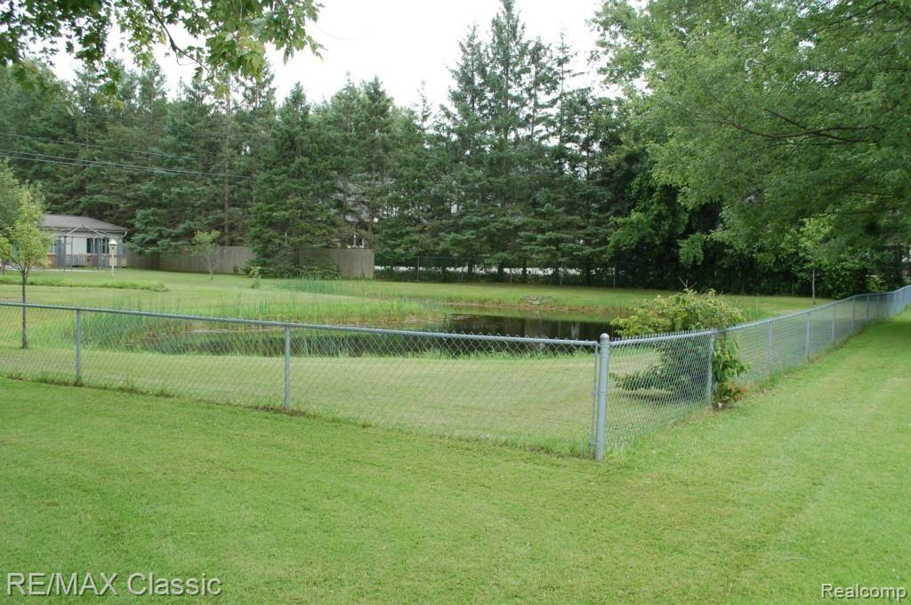 9745 North Eston Road Clarkston, MI 48348 - Photo 43 of 53 POND INSIDE OF FENCED AREA IN YARD