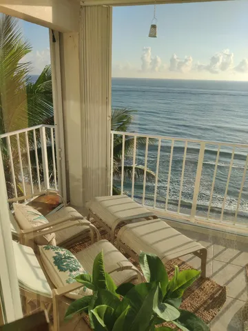 a living room with furniture rug and a large window