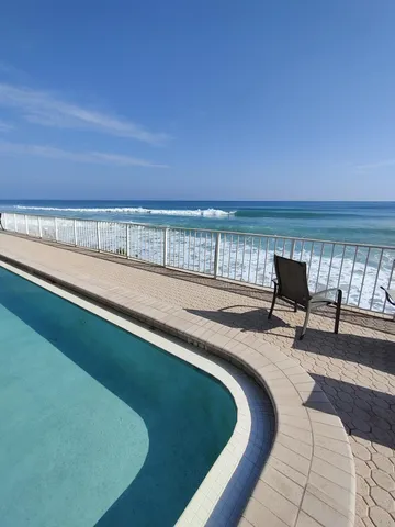 a kitchen with granite countertop a sink cabinets and window