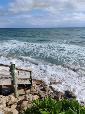 a view of a balcony with furniture