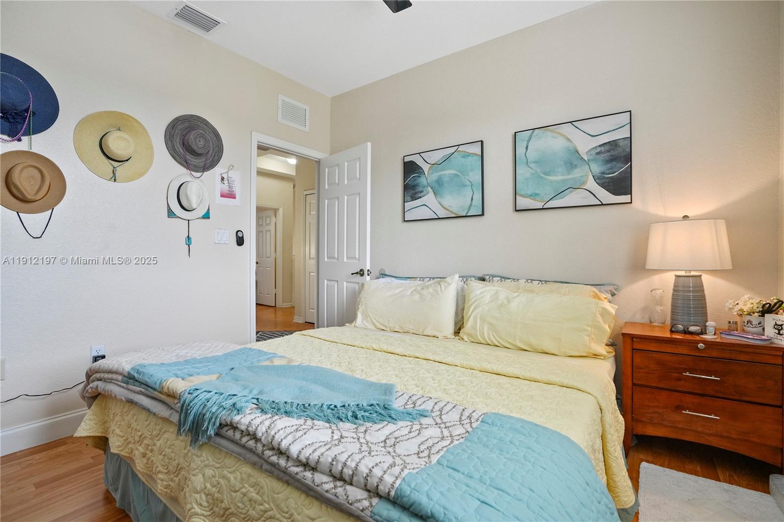 11753 Southwest 137th Path Miami, FL 33186 - Photo 11 of 33 a bedroom with a bed and painting on the wall