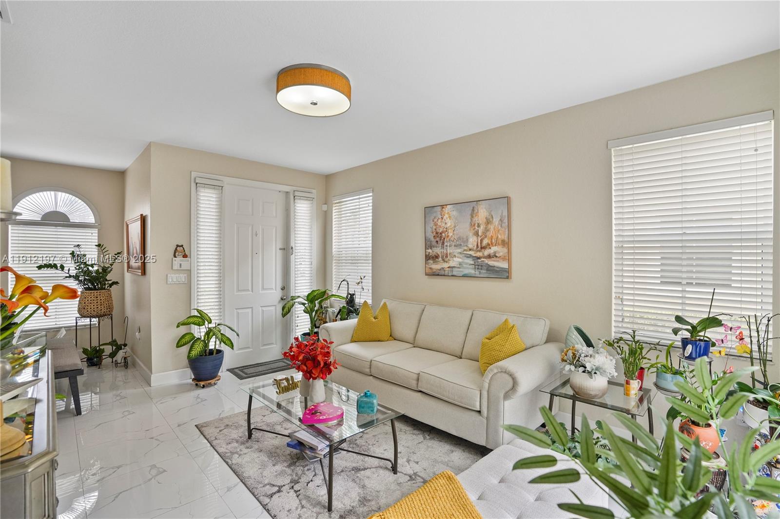 11753 Southwest 137th Path Miami, FL 33186 - Photo 20 of 33 a living room with furniture and flowers