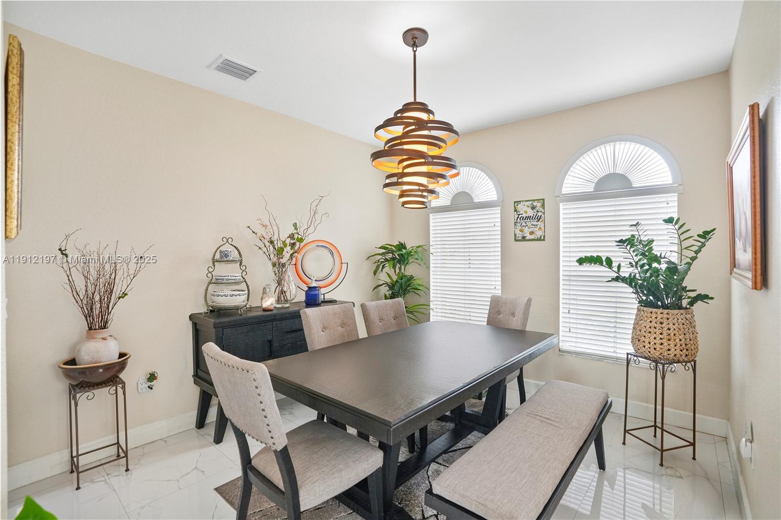 11753 Southwest 137th Path Miami, FL 33186 - Photo 21 of 33 a view of a dining room with furniture and wooden floor