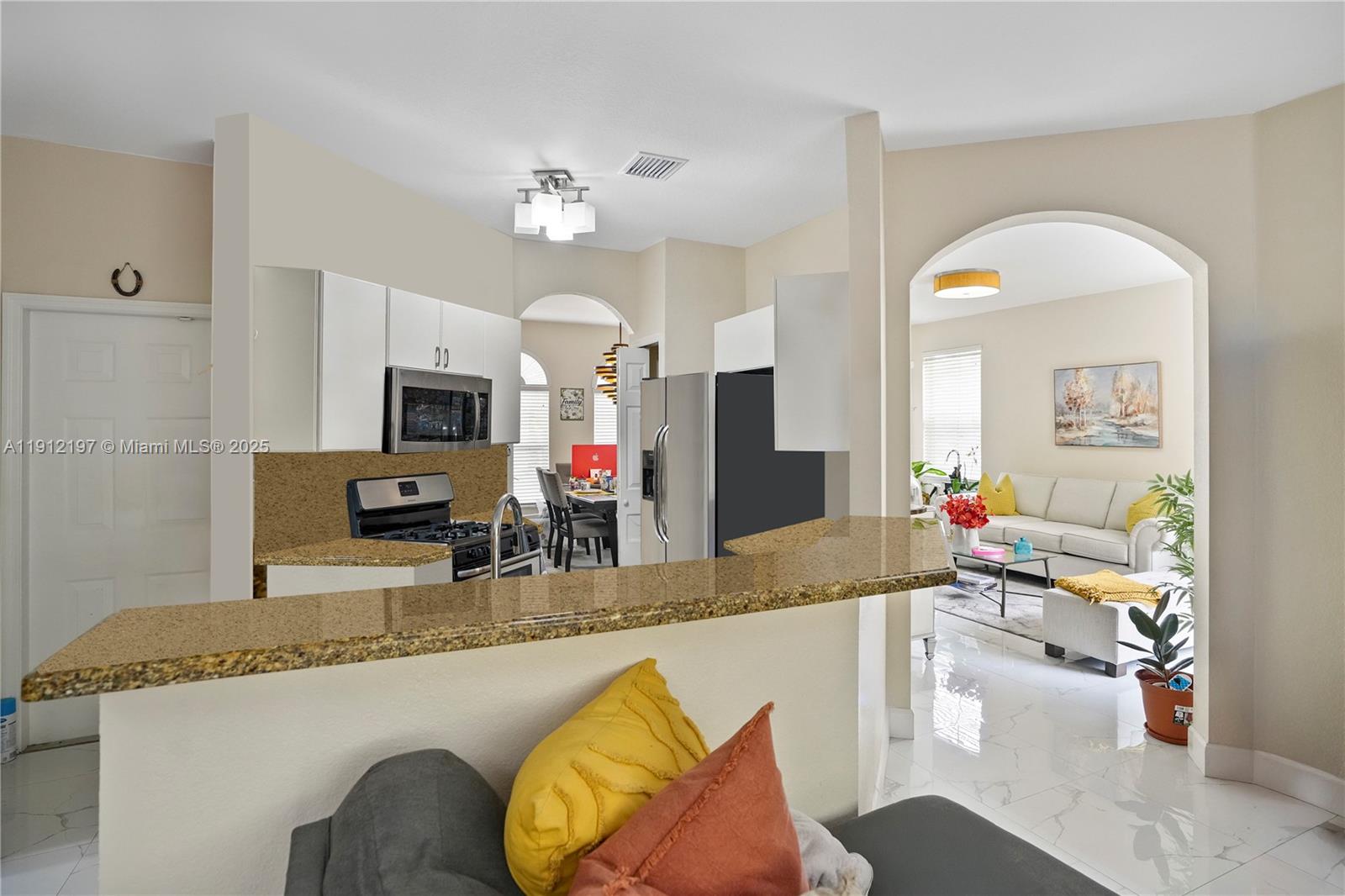 11753 Southwest 137th Path Miami, FL 33186 - Photo 25 of 33 a living room with furniture and a flat screen tv