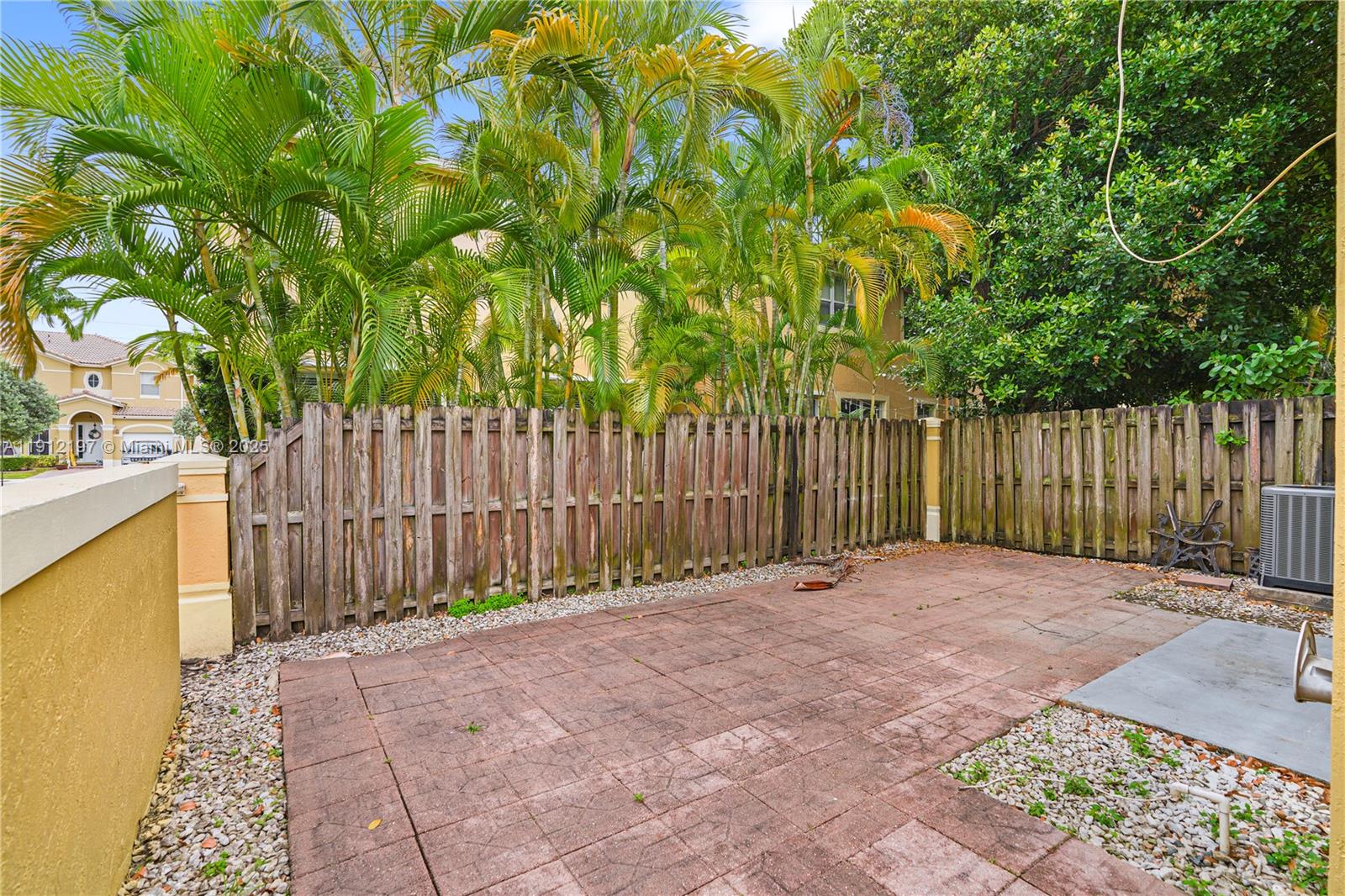 11753 Southwest 137th Path Miami, FL 33186 - Photo 28 of 33 a view of backyard with wooden fence and trees
