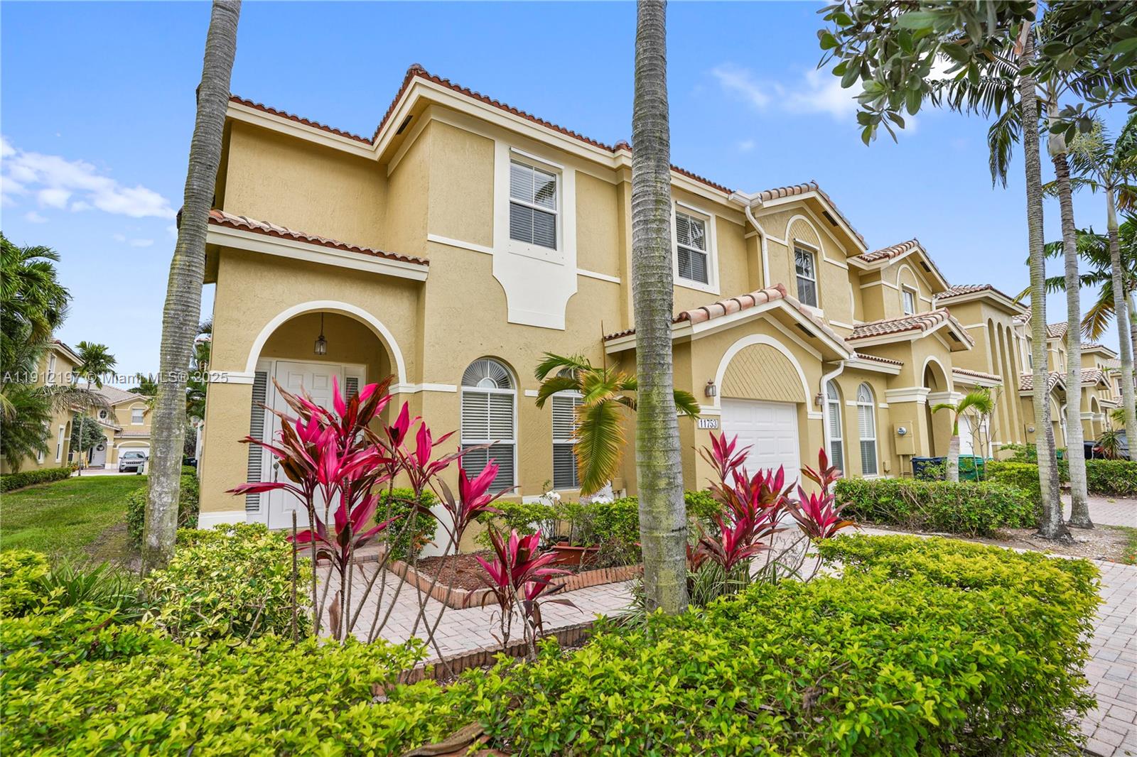 11753 Southwest 137th Path Miami, FL 33186 - Photo 3 of 33 front view of a house with a yard