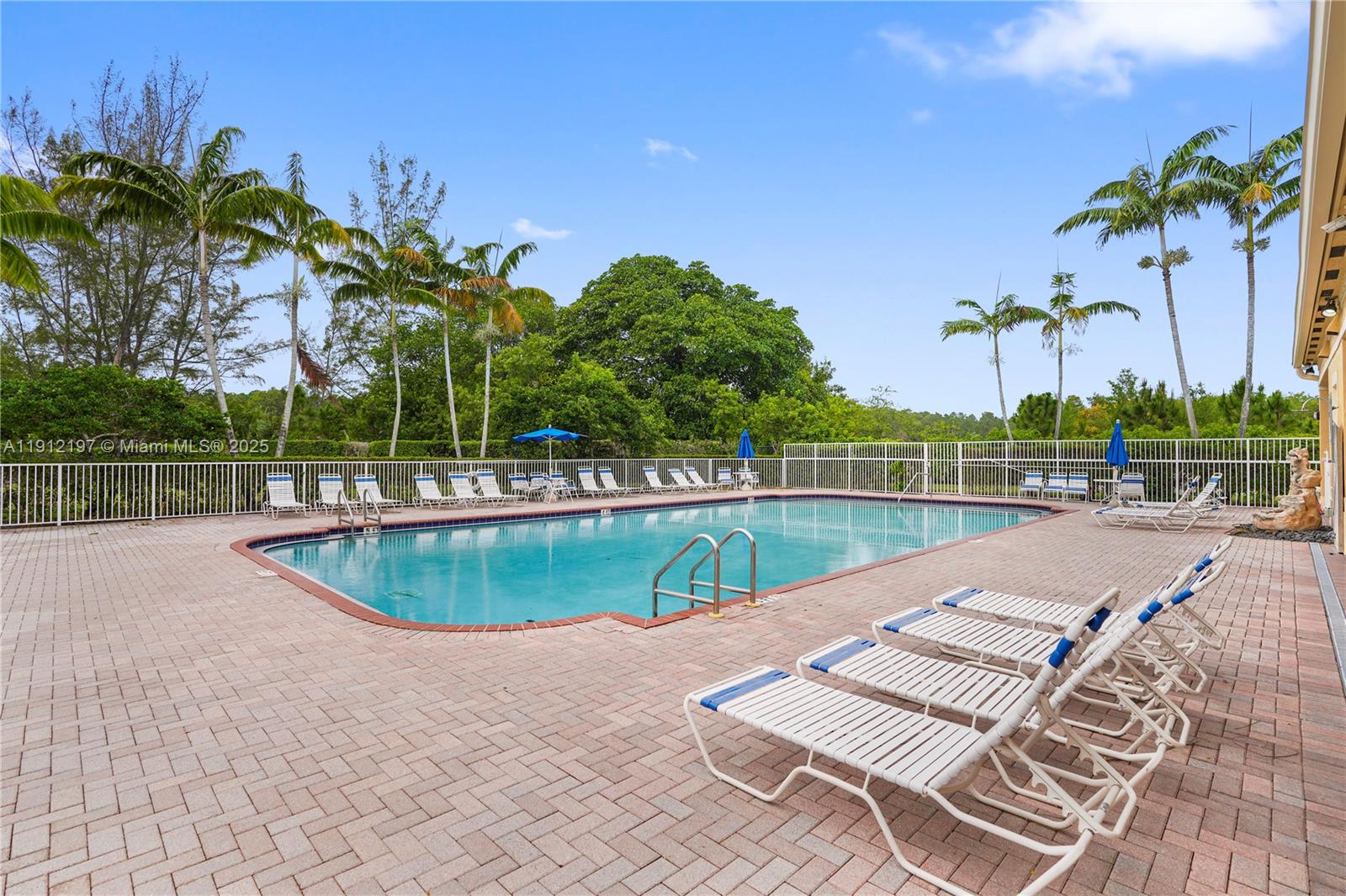 11753 Southwest 137th Path Miami, FL 33186 - Photo 31 of 33 a view of a swimming pool with a lake view