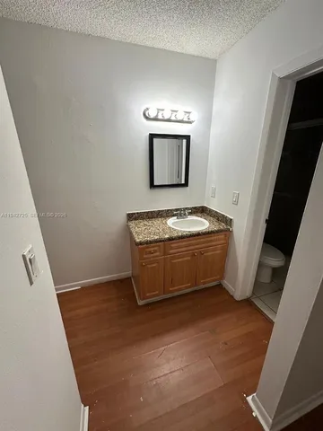 an empty room with a bathroom