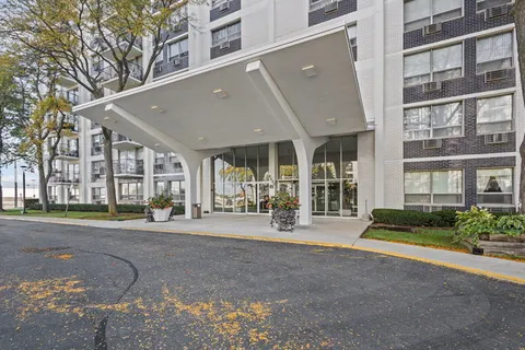 a front view of a building with street view