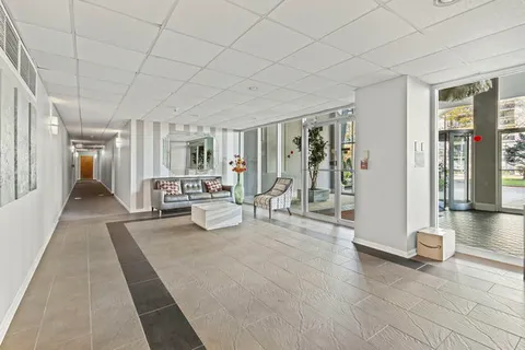 a view of a livingroom with furniture and door