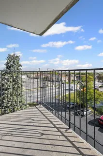 a view of balcony with wooden floor