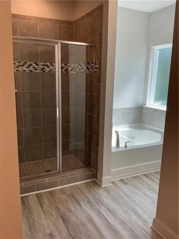 a bathroom with a glass shower door