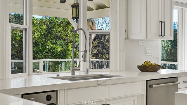 a kitchen with a sink and a window