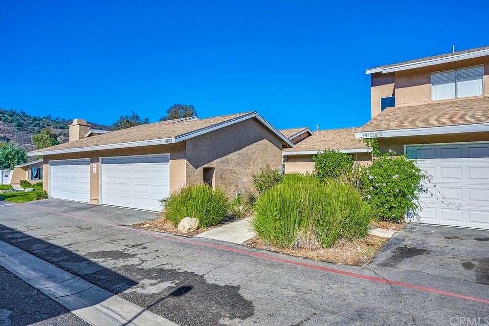 44705 La Paz Road, Unit B Temecula, CA 92592 - Photo 1 of 1 a view of a house with a yard and plants
