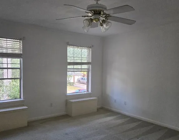 a view of an empty room with a window