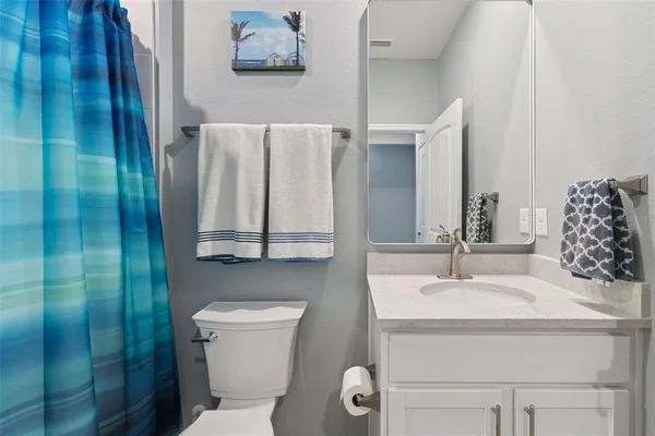 a bathroom with a sink and mirror