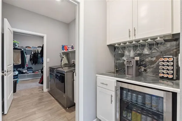 a kitchen with stainless steel appliances granite countertop a stove and cabinets